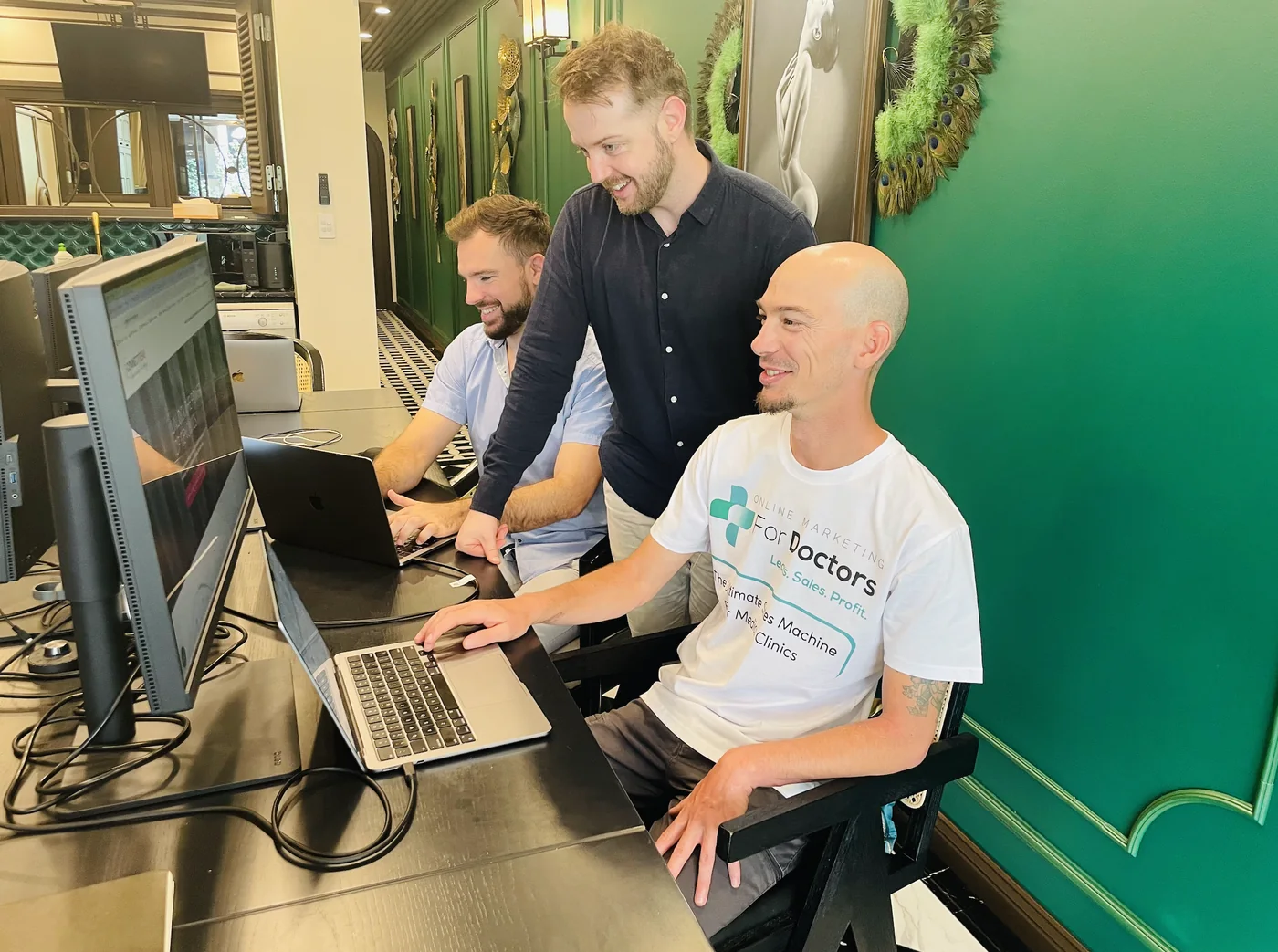 Three of the team reviewing client results together